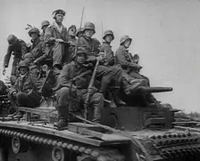 German Soldiers Riding Tanks, 1941. Creator: British Pathe Ltd