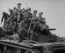 German Soldiers Riding Tanks, 1941. Creator: British Pathe Ltd