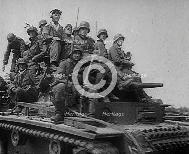 German Soldiers Riding Tanks, 1941. Creator: British Pathe Ltd.