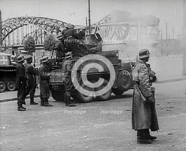 German Soldiers Standing Next to a Truck-Mounted Gun, 1942. Creator: British Pathe Ltd.