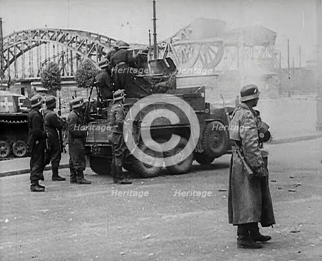 German Soldiers Standing Next to a Truck-Mounted Gun, 1942. Creator: British Pathe Ltd.