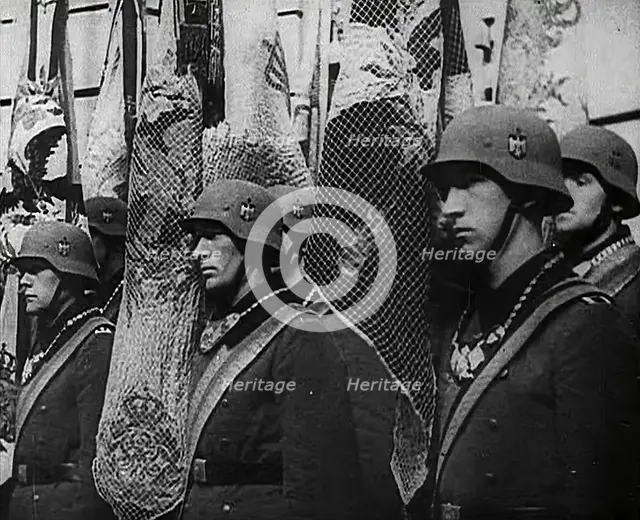 German Soldiers Standing With Flags, 1941. Creator: British Pathe Ltd.