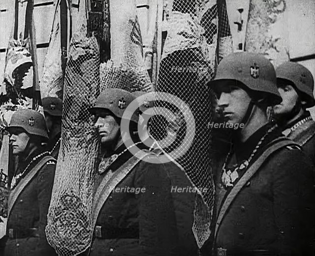 German Soldiers Standing With Flags, 1941. Creator: British Pathe Ltd.