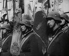 German Soldiers Standing With Flags, 1941. Creator: British Pathe Ltd