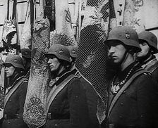 German Soldiers Standing With Flags, 1941. Creator: British Pathe Ltd
