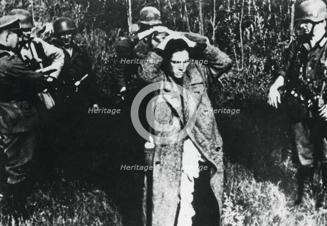 German soldiers with Russian prisoners, Russia, 1941. Artist: Unknown