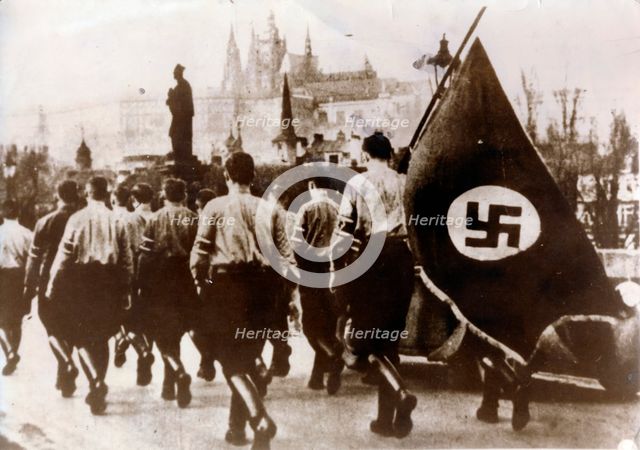 German troops enter Prague over the Charles Bridge, 15th March 1939. Creator: Unknown.