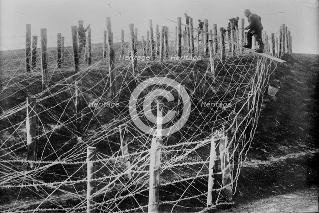 Germans fixing barbed wire tangle, between c1914 and c1915. Creator: Bain News Service.
