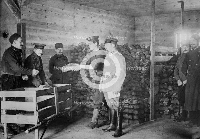 Giving Bread to British prisoners, between 1914 and c1915. Creator: Bain News Service.