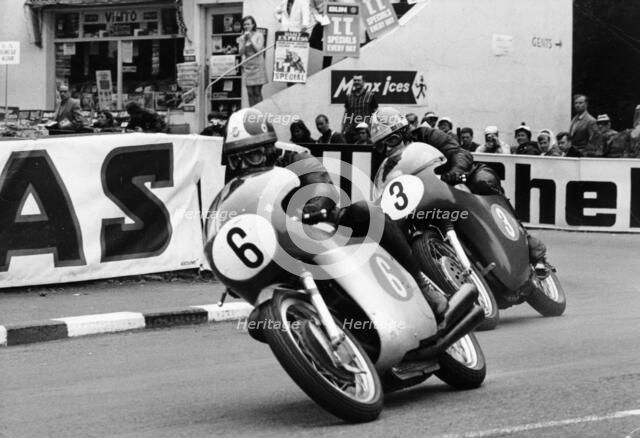 Giacomo Agostini on bike number 6, Tom Dickie on bike number 3, Isle of Man Junior TT, 1968. Artist: Unknown