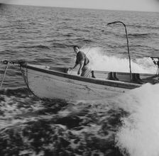Giacomo Frusteri in the prow of the seining boat as it races to..., Gloucester, Massachusetts, 1943. Creator: Gordon Parks