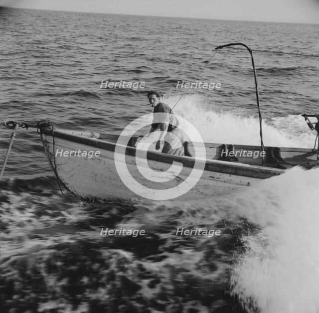 Giacomo Frusteri in the prow of the seining boat as it races to..., Gloucester, Massachusetts, 1943. Creator: Gordon Parks.