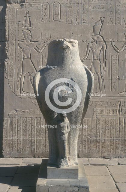 Giant statue of the Ancient Egyptian falcon-headed god Horus, Edfu, Egypt. Artist: Unknown