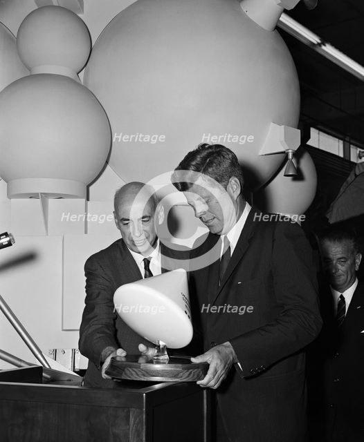 Gilruth presents President Kennedy with a model of the Apollo spacecraft, 1960s. Creator: Unknown.