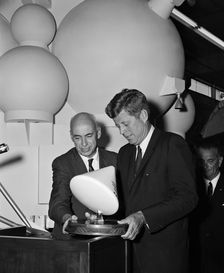 Gilruth presents President Kennedy with a model of the Apollo spacecraft, 1960s. Creator: Unknown