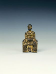 Gilt bronze Buddha seated on a lion-flanked throne, Six Dynasties period, China, 5th century AD