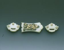 Gilt-bronze mounted group of three jade belt fittings, Liao dynasty or earlier, China, c907-1125