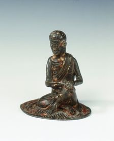 Gilt bronze statue of a lohan seated on a rush mat, late Ming dynasty, China, 1600-1644. Creator: Unknown