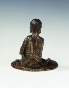 Gilt bronze statue of a lohan seated on a rush mat, late Ming dynasty, China, 1600-1644. Creator: Unknown