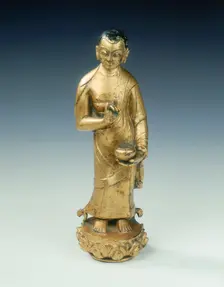 Gilt bronze statue of a standing monk with begging bowl, Yuan dynasty, China, 14th century. Creator: Unknown