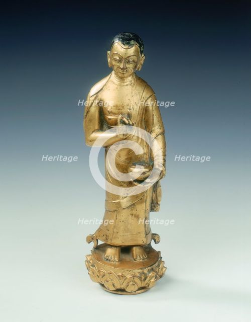 Gilt bronze statue of a standing monk with begging bowl, Yuan dynasty, China, 14th century. Creator: Unknown.