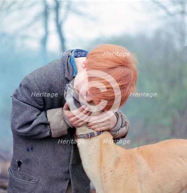 Gipsy boy with a dog, Charlwood, Newdigate area, Surrey, 1964.
