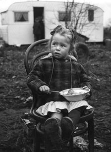 Gipsy girl eating, Lewes, Sussex, 1964