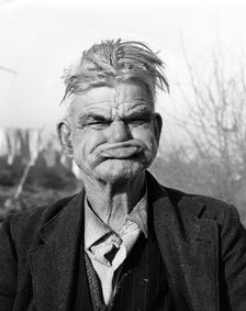 Gipsy pulling a gurney face Lewes, Sussex, 1964