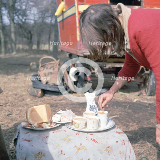 Gipsy woman making tea, Charlwood, Newdigate area, Surrey, 1964. 