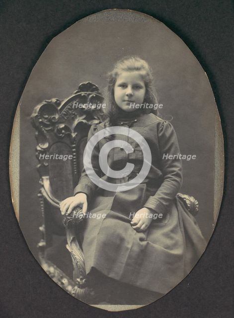 [Girl with Ringlets, Seated, Three-Quarter Length], 1890s. Creator: Frederick Gutekunst.