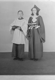 Girl and boy chorister, (Isle of Wight?), c1935. Creator: Kirk & Sons of Cowes