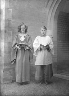 Girl and boy chorister, (Isle of Wight?), c1935. Creator: Kirk & Sons of Cowes