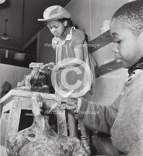 Girl and boy sculpting, Harlem Art Center, 1939. Creator: Berenice Abbott.