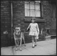 Girl and dog, Middleport, Burslem, Stoke-on-Trent, Staffordshire, 1965-1968. Creator: Eileen Deste