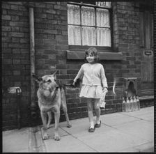 Girl and dog, Middleport, Burslem, Stoke-on-Trent, Staffordshire, 1965-1968. Creator: Eileen Deste