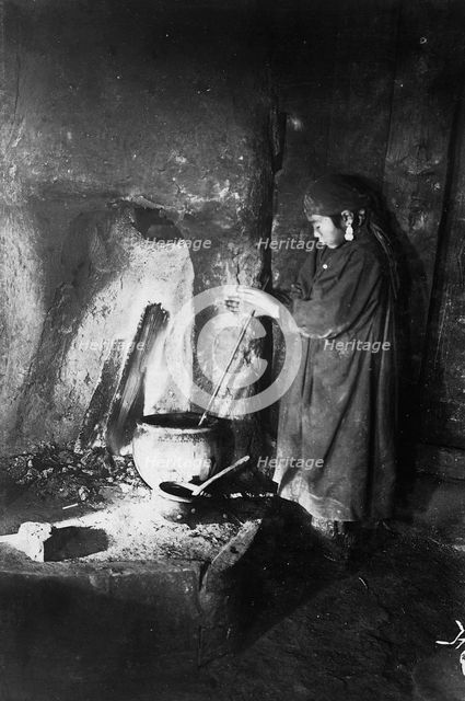 Girl at the hearth, late 19th cent - early 20th cent. Creator: I Popov.