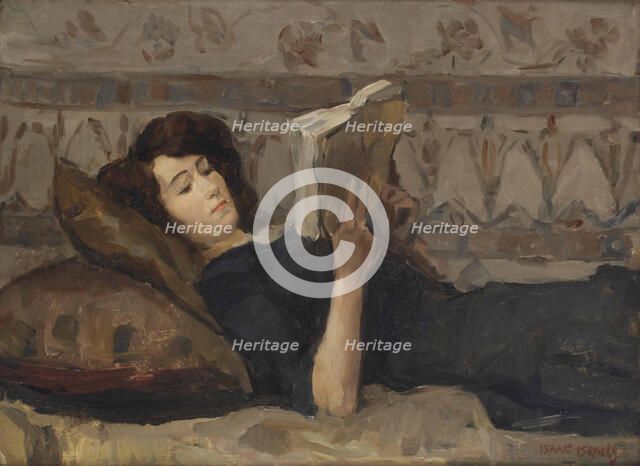 Girl reading on a sofa, c. 1920.