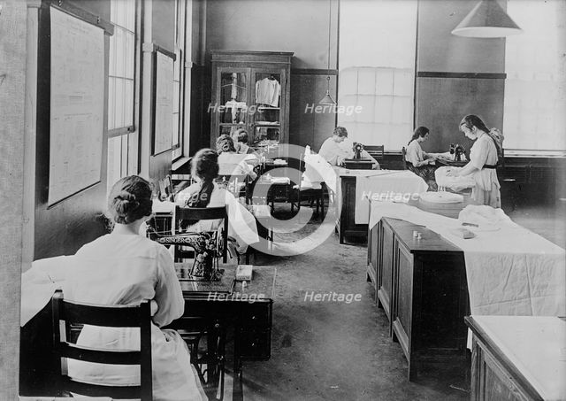 Girl Scouts - War Sewing with Red Cross, 1917. Creator: Harris & Ewing.