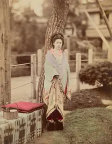 Girl standing near tree, 1870s-1890s. Creator: Kusakabe Kimbei