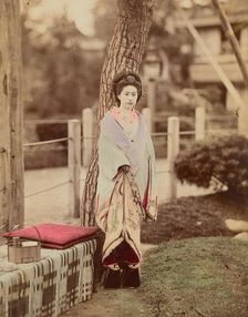 Girl standing near tree, 1870s-1890s. Creator: Kusakabe Kimbei