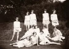 Girls Greek dancing class pose on lawn, 1929