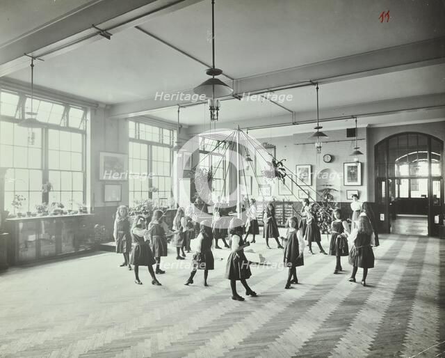 Girls dancing around a maypole, Hugon Road School, Fulham, London, 1907. Artist: Unknown.