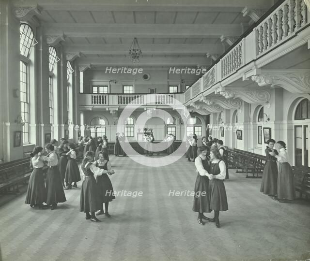 Girls dancing in the assembly hall, Clapham Secondary School, London, 1910. Artist: Unknown.