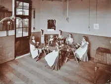 Girls knitting socks by machine at the Elm Lodge School for Blind Girls, London, 1908