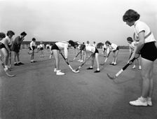 Girls hockey match, Airedale school, Castleford, West Yorkshire, 1962. Creator: Michael Walters