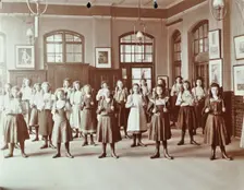 Girls holding Indian clubs, Cromer Street School/ Argyle School, St Pancras, London, 1906