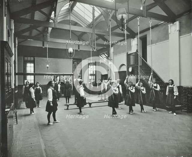 Girls in the gymnasium, Fulham County Secondary School, London, 1908. Artist: Unknown.