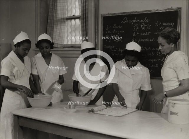 Girls instructed in pastry making at Colored Household Training School, 1937. Creator: Wilson.