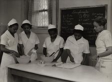 Girls instructed in pastry making at Colored Household Training School, 1937. Creator: Wilson