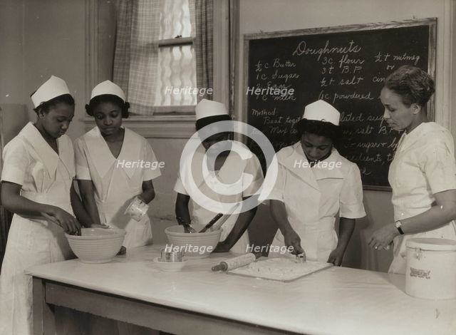 Girls instructed in pastry making at Colored Household Training School, 1937. Creator: Wilson.